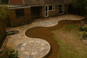 Stonemarket Vintage Abbey Earthern Paving with Vintage Compass Circles as installed by the landscape division